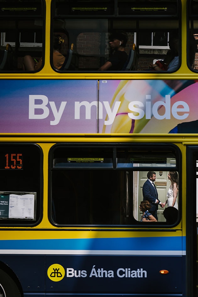 A photograph of a couple with Dublin Bus